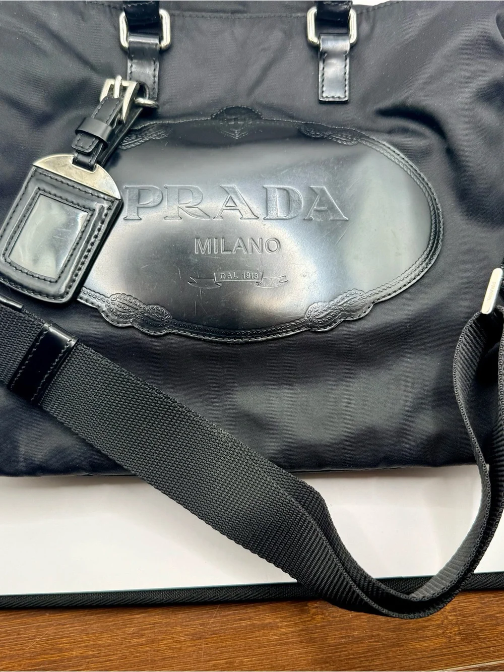 Prada Black Nylon & Leather Bag with Embossed Prada logo.